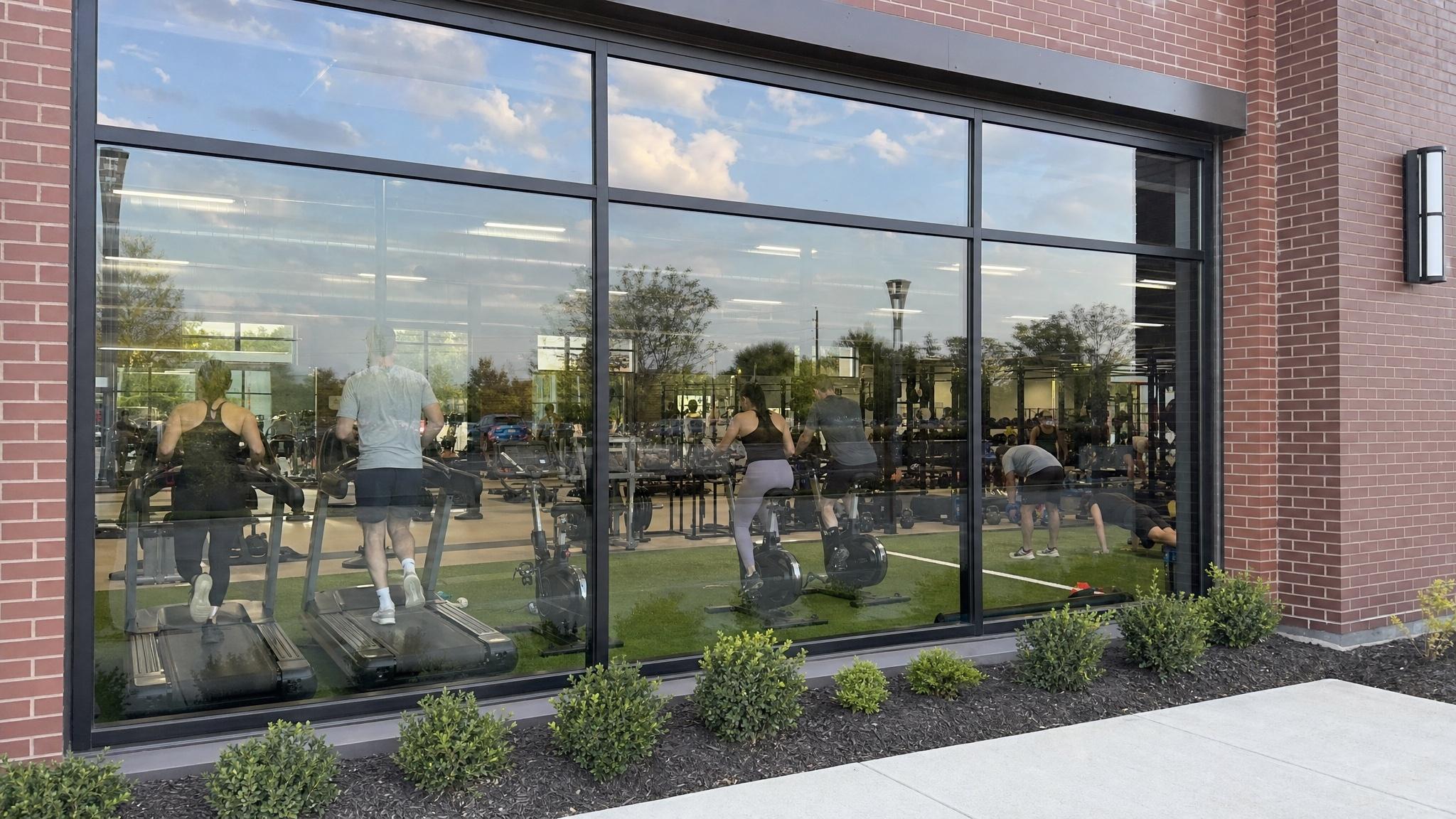 Commercial gym storefront with reflective architectural window film