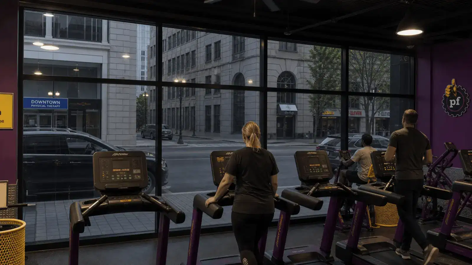 Interior Planet Fitness view looking out through dark architectural window film